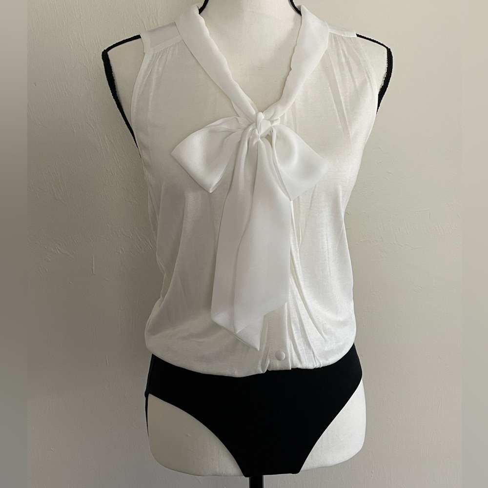 Buttoned Up Sleeveless Onesie with Bow Tie.